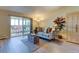 Comfortable living room with neutral tones, balcony, and stylish furnishings at 9180 E Center Ave # 9D, Denver, CO 80247