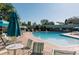 The community pool is surrounded by lounge chairs for relaxation and recreation at 9180 E Center Ave # 9D, Denver, CO 80247