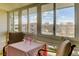 Bright sunroom with large windows and scenic views, perfect for relaxing or entertaining at 9180 E Center Ave # 9D, Denver, CO 80247