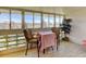 Cozy sunroom with large windows, offering views of the surrounding neighborhood at 9180 E Center Ave # 9D, Denver, CO 80247