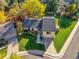 An aerial view of a landscaped home with mature trees, a well-kept lawn, and a welcoming facade at 7162 S Fillmore Cir, Centennial, CO 80122