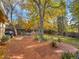 Backyard with mature trees and a brick patio dining area at 7162 S Fillmore Cir, Centennial, CO 80122