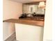 Cozy bar area features a sink, countertop, and decorative mirror at 7162 S Fillmore Cir, Centennial, CO 80122