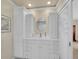 Bathroom features a round mirror and spacious vanity with plenty of storage at 7162 S Fillmore Cir, Centennial, CO 80122