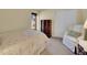 Well-lit bedroom with carpet, window, dresser, and closet at 7162 S Fillmore Cir, Centennial, CO 80122