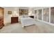 Cozy bedroom featuring a queen-sized bed, natural light, and decorative closet doors at 7162 S Fillmore Cir, Centennial, CO 80122