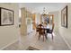 Elegant dining room with chandelier, bay window, and classic decor for memorable gatherings at 7162 S Fillmore Cir, Centennial, CO 80122