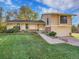 Well-maintained two-story home with lush green lawn, mature trees, and a welcoming entrance at 7162 S Fillmore Cir, Centennial, CO 80122