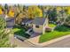 Inviting two-story home with well-manicured lawn and beautiful fall foliage at 7162 S Fillmore Cir, Centennial, CO 80122