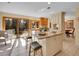 Open kitchen features granite counters, stainless appliances and adjoins a cozy sitting room with backyard access at 7162 S Fillmore Cir, Centennial, CO 80122