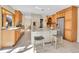 Bright and airy kitchen featuring a center island with seating, stainless appliances, and lots of counter space at 7162 S Fillmore Cir, Centennial, CO 80122