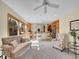 Bright living space connecting to a modern kitchen, featuring comfortable seating and ample natural light at 7162 S Fillmore Cir, Centennial, CO 80122