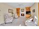 Inviting living room featuring a fireplace, built-in shelving, and comfortable seating for relaxation at 7162 S Fillmore Cir, Centennial, CO 80122