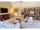 Bright living room featuring built-in shelving, comfortable seating, and an open floor plan at 7162 S Fillmore Cir, Centennial, CO 80122