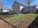 Spacious backyard with sunny sky and green grass at 17605 E Temple Dr, Aurora, CO 80015