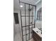 Modern bathroom with glass-enclosed shower, vanity, and decorative lighting at 17605 E Temple Dr, Aurora, CO 80015