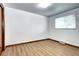 Bright bedroom with wood-look floors and a neutral color palette at 6340 Quay St, Arvada, CO 80003