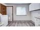 Bright laundry area with updated appliances, cabinets, and countertops at 6340 Quay St, Arvada, CO 80003