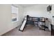 Bright bedroom features a loft bed with a slide and a window at 14419 Dahlia St, Thornton, CO 80602