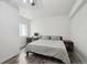 Bedroom features natural light, a neutral color palette, and wood-look flooring at 14419 Dahlia St, Thornton, CO 80602