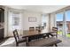 Comfortable dining area with a large wooden table, bench, and natural light, perfect for Gathering meals at 14419 Dahlia St, Thornton, CO 80602