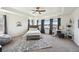 Spacious main bedroom featuring a tray ceiling, plush carpet, and large windows for natural light and comfort at 14419 Dahlia St, Thornton, CO 80602