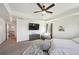 Large main bedroom with a ceiling fan, plush carpet, and ample natural light, offering a serene retreat at 14419 Dahlia St, Thornton, CO 80602