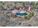 Aerial view of community pool, clubhouse, and surrounding landscape at 22178 E Stroll Ave, Parker, CO 80138