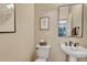 Powder room with pedestal sink and simple decor at 22178 E Stroll Ave, Parker, CO 80138