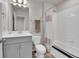 Well-lit bathroom featuring a shower-tub combo and vanity with modern fixtures at 6350 N Lisbon St, Aurora, CO 80019