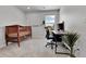 Bright bedroom with a crib, desk, computer and office chair in a well lit room at 6350 N Lisbon St, Aurora, CO 80019