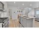 Bright kitchen with stainless steel appliances, granite counters, and open layout at 6350 N Lisbon St, Aurora, CO 80019