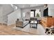 Inviting living room featuring stylish furniture, natural light, and staircase at 6350 N Lisbon St, Aurora, CO 80019
