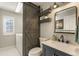 Stylish bathroom features a sliding barn door, modern vanity, and updated fixtures at 9898 Mulberry Way, Highlands Ranch, CO 80129