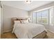 Comfortable bedroom with large bay windows and plush carpeting at 9898 Mulberry Way, Highlands Ranch, CO 80129
