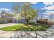 Charming home showcasing a well-manicured lawn and a three-car garage, offering both curb appeal and convenience at 9898 Mulberry Way, Highlands Ranch, CO 80129
