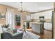 Stylish kitchen with a center island, white cabinets, stainless steel appliances, and access to the deck at 9898 Mulberry Way, Highlands Ranch, CO 80129