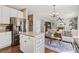 Open-concept kitchen and living room offer seamless flow and modern living at 9898 Mulberry Way, Highlands Ranch, CO 80129