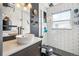 Modern bathroom with sleek vanity, vessel sink, and walk-in shower featuring white subway tile at 1325 S Clermont St, Denver, CO 80222