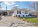 Charming single-story home featuring a covered carport and well-maintained front yard at 1325 S Clermont St, Denver, CO 80222