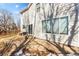Backyard featuring stone patio, grass area, and access to the house via sliding glass door at 13277 Elizabeth St, Thornton, CO 80241
