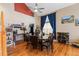 Dining area with hardwood floors, wine rack, and a staircase leading to the second floor at 13277 Elizabeth St, Thornton, CO 80241