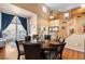 Open concept living room with dining area with high ceilings and a view of the upper level at 13277 Elizabeth St, Thornton, CO 80241