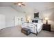 Spacious bedroom featuring an upholstered metal bed frame and access to the home's ensuite bathroom at 1102 Buffalo Ridge Rd, Castle Pines, CO 80108