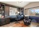 Home office with custom built-ins, dark wood trim, and a massage chair at 1102 Buffalo Ridge Rd, Castle Pines, CO 80108