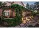 Covered patio with climbing vines provides a tranquil outdoor space at 1102 Buffalo Ridge Rd, Castle Pines, CO 80108