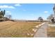 Backyard features a sidewalk with a water view and open grass at 4760 S Wadsworth Blvd # G304, Littleton, CO 80123