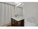 Cozy bathroom features a vanity with storage, a mirror and decorative fish at 4760 S Wadsworth Blvd # G304, Littleton, CO 80123