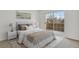 Bright bedroom featuring a sliding glass door and neutral decor with carpet flooring at 4760 S Wadsworth Blvd # G304, Littleton, CO 80123