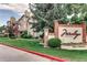 Charming condominium community with lush landscaping, a welcoming sign, and well-maintained exteriors at 4760 S Wadsworth Blvd # G304, Littleton, CO 80123